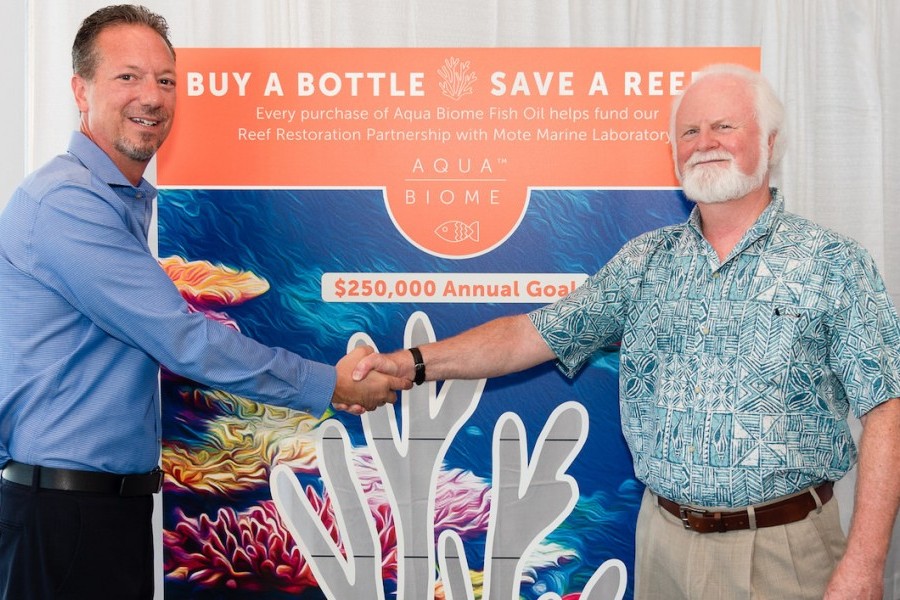 Scott Sensenbrenner, Enzymedica, and Dr. Michael P. Crosby, Mote, celebrate Enzymedica's support of Mote's coral restoration