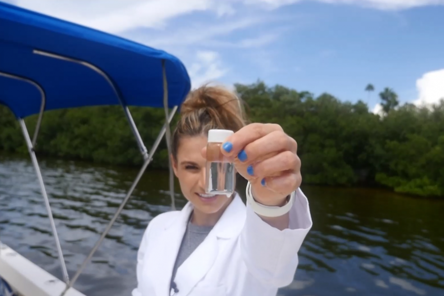 Dr. Tracy Fanara of Mote Marine Laboratory collects a water sample in Sarasota, Florida. 
