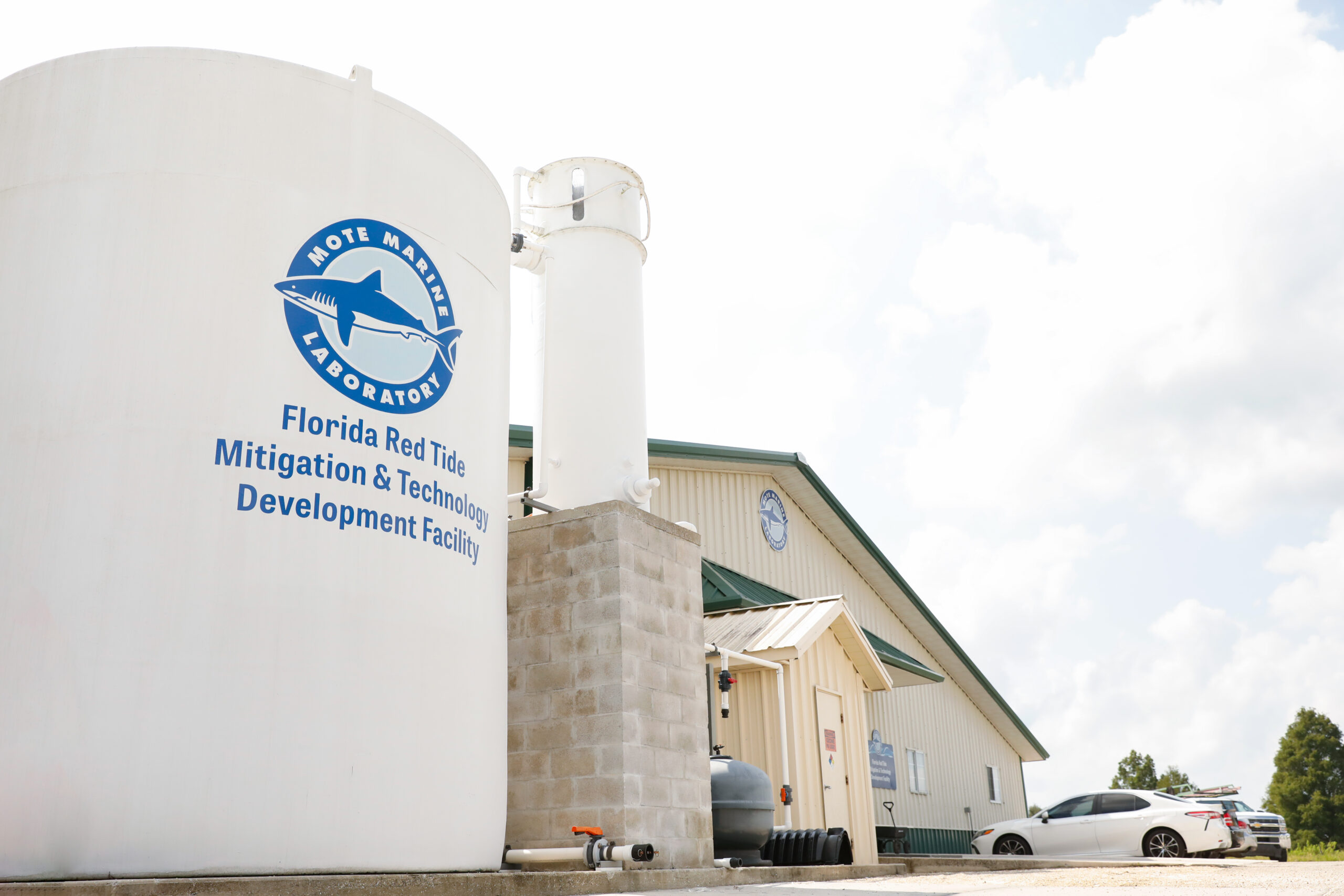 Water towers outside a large research building.