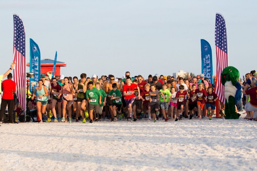 Runners begin the 5K race at Mote's Run for the Turtles.