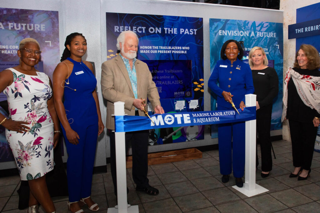 Staff and leaders from Mote and the Yocum African American History Association cut the ribbon for the new Trailblazers in STEM display at Mote Aquarium.