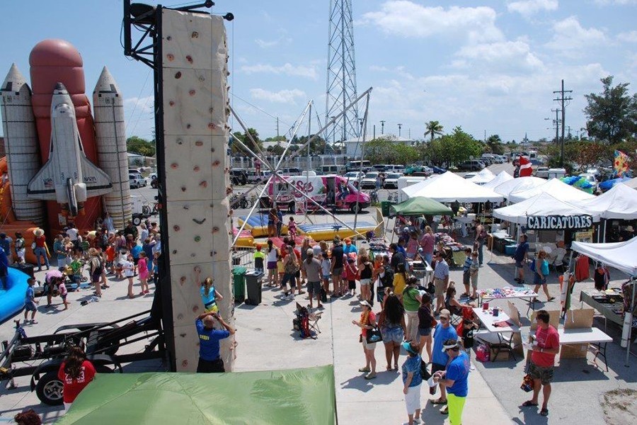 Kids playing at Ocean Fest's amusement park.