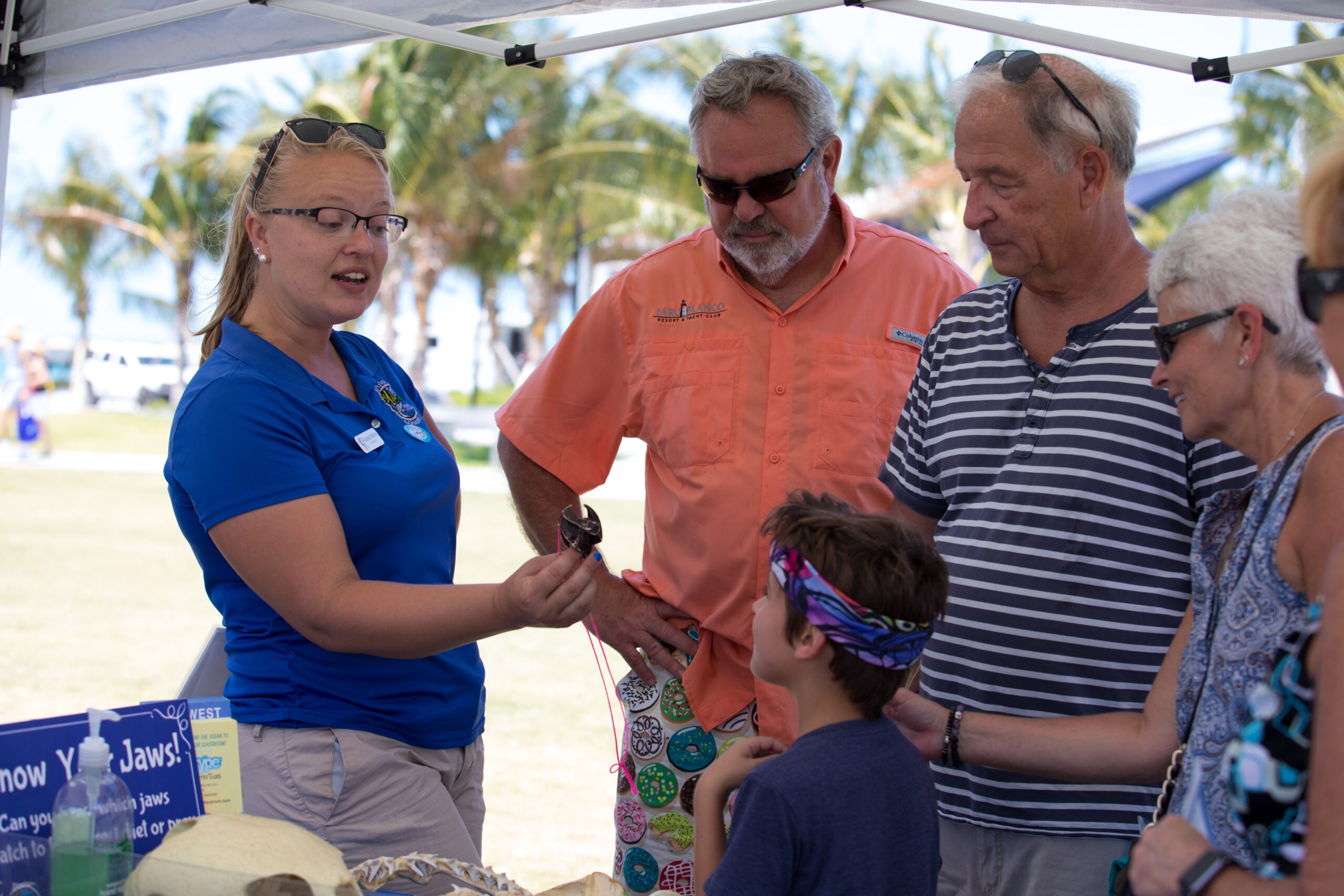 A Mote staff member speaks to members of the public at an outreach event in the Florida Key.