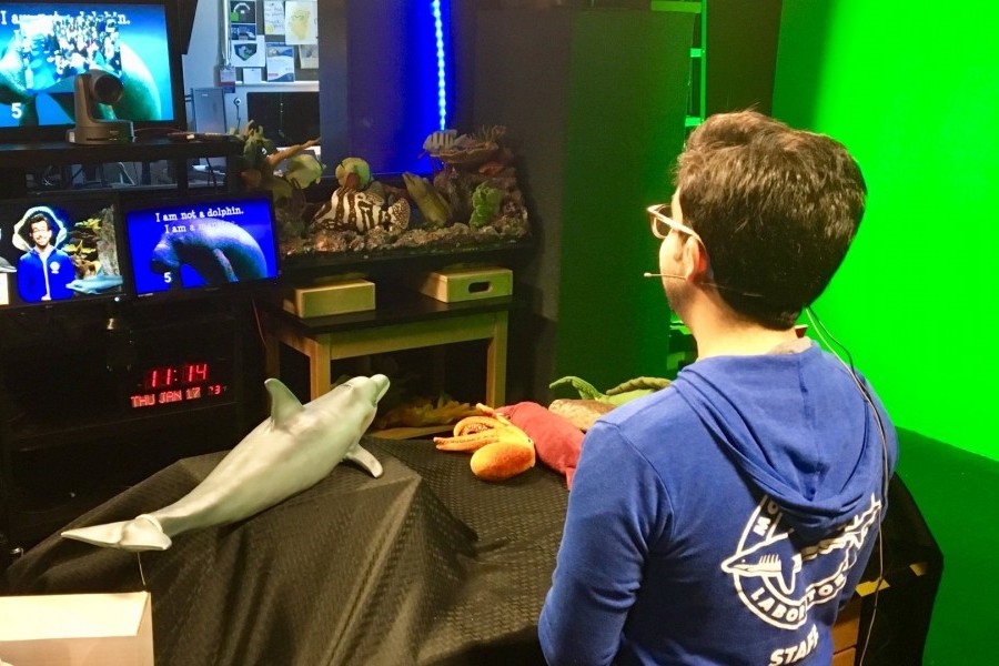 Ross Johnston, Education Specialist for Virtual Learning, reads an interactive storybook about dolphins to students in Arizona.