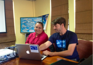 Dr. Demian Chapman meets with colleagues in Belize.