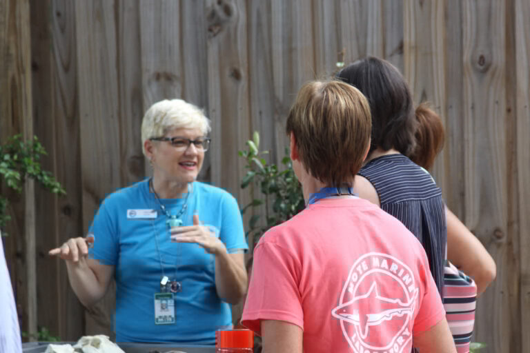 Mote volunteer with guests