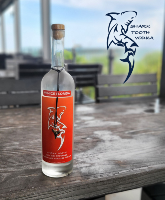 Shark Tooth Vodka bottle with logo